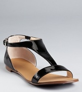 A lesson in sophistication. Boutique 9's Piraya sandals boast glossy patent leather with polished style.