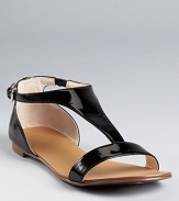 A lesson in sophistication. Boutique 9's Piraya sandals boast glossy patent leather with polished style.