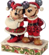 Old Saint Mick! Dressed up in a folksy take on Santa's red suit, Mickey celebrates the joy and jubilation of Christmas with his Mrs. Claus. Mickey's and Minnie's signature mouse ears get a glimmering, eye-catching update that plays with the whimsical shapes & designs on this figurine.