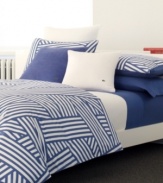 A new twist on nautical. Lacoste's Regate duvet cover set dresses your bed in seaworthy style with a bold print of intertwined, layered stripes in dutch blue and pure white. The duvet cover boasts button closure with pearl Lacoste buttons while the sham features overlap closure. Also features pure cotton twill. (Clearance)