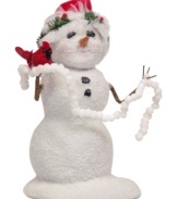 A glistening snowman gets into the spirit, carrying a strand of popcorn to string on a tree. A holiday-red cardinal and holly-trimmed hat complete the handcrafted collectible from Byers' Choice.