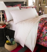 Show off your creative streaks. The Midnight sheet set features a subtle light pink stripe that counters the bright blossom print on the comforter and shams with a hint of ladylike style. (Clearance)