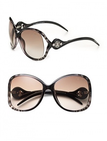 Tubular acetate frames with open lens is adorned with a signature Cavalli emblem at temple. Available in gradient black on zebra with brown gradient lens or palladium/pearl brown with brown gradient lens. 100% UV protection Made in Italy 