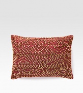 A rustic, wholly exotic pillow is defined by wood beads that add depth and texture wherever you place it.12 X 16Beaded cottonSpot cleanImported