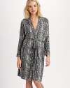 Add a touch of the exotic to your loungewear in this chic belted wrap.Foldover necklinePiped trimSelf-beltPatch pocketsAbout 38 from shoulder to hemLyocellMachine washImported