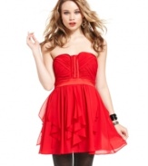 Get voted best dressed! XOXO's red-hot frock anchors a super-structured, paneled bodice with a skirt of airy ruffles.