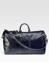 GG-coated fabric with bordeaux leather trim and locked zip closure. Ruthenium hardware Top handles Adjustable, detachable shoulder strap 10½W X 11½H X 20½L Made in Italy 