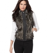 Calvin Klein's reversible vest does double time with chic faux fur on one side and classic plaid on the other.