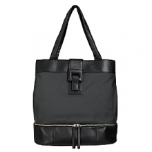 Washable coated linen tote with cowhide leather trim. Separate bottom compartment fits a pair of shoes and other travel items. Straps fit over shoulder. Interior organization pockets. Magnetic closure. Lined.