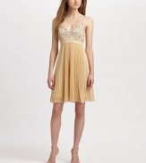 A garden of stitched posies blooms above a fresh pleated skirt.Adjustable straps Banded Empire waist Invisible side zip closure About 20 from natural waist Polyester; polyester lining Specialist dry clean Imported