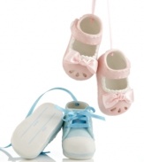 A perfect gift for new parents, baby shoe ornaments from Midwest are crafted of pale pink or blue porcelain with coordinating ribbon. Flip them over to fill out the date and child's name.