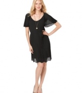 Make an impression in Studio M's elegant pleated dress. The lightweight fabric gives this look an airy, ethereal feel!