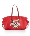 Snakeskin patent handles and fringe accent this matte tote embellished with Ed Hardy's signature Love Kills Slowly graphic and rhinestones.