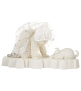 This bundled Snowbaby stares in wonderment at a sweet pup in this cherished figurine from Department 56. Crafted of porcelain bisque with glitter details.