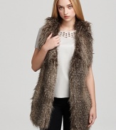 In plush faux fur, Black Halo's Braiden vest lends a cozy layer over a silk tee and black skinnies.