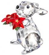 A bunny with a bouquet, this adorable figurine sparkles in faceted Swarovski crystal. Red poinsettias play up the Christmas cheer in a collectible that charms year-round.