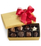 Donned with a soft red bow, this classic collection of Godiva chocolates makes a perfectly sweet and irresistible gift this season in its shimmering gold box.