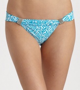 Smooth stretch knit features ocean inspired abstract graphics and silvertone bead accents.Mid-rise waistband Fold-over top with beaded accents Fully lined 85% Meryl nylon/15% spandex Fully lined Hand wash ImportedPlease note: Bikini top sold separately. 
