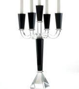 Towering over a room in bold, dramatic fashion, the Sussex candelabra is all you need to redefine the dining table. Five arms of alternating black and clear crystal with sleek, faceted detail require no candlelight to make a magnificent statement. From Lighting by Design.