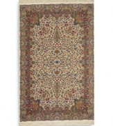 Deeply colorful and elaborately designed, this 30-color Kirman rug is inspired by the intense hues and exceptional intricacies of hand-knotted rugs of ancient Persia. Each color is individually skein-dyed for jewel-tone clarity. A patented wash process creates a vintage finish faithful to the craftsmanship of the original. Woven in the USA of premium fully worsted New Zealand wool.