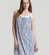 An adorable striped sleeveless knit gown with scalloped edge lace trim and flower shaped buttons.