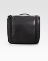 EXCLUSIVELY OURS. A compact leather carry-on case unzips to reveal a hanger inside. Hang it on the towel rack, shower bar or in the closet for space-saving ease in cramped hotel rooms everywhere. Top handle Zip closure Waterproof taffeta lining 9¼W X 7¼H X 3¾D Imported 