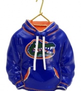 Fitting for Florida alum, this hand-painted hoodie ornament trims the tree in Gators orange and blue. Glitter amps up the school and holiday spirit.