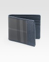 The iconic check design is reborn in this finely crafted leather wallet. Bill compartment Six card slots Leather 3 X 4 Made in Italy 