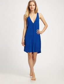A simple V-neck shift of supple silk chiffon, finished with a bold colorblock back.V necklineSleevelessShirttail hemV-back with center ruchingAbout 20 from natural waist93% silk/7% elastaneHand washImported