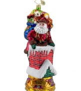 Down through the chimney goes St. Nick! Christopher Radko catches and captures him in the act, recreating the scene in mouth-blown, hand-painted glass. Brilliant color and detail in his face, bag of gifts and in the chimney itself make the ornament a favorite.