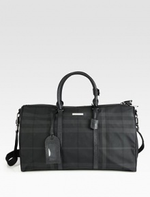 An essential carryall, roomy enough for trips to the gym or a weekend getaway, in lightweight nylon with leather trim.Zip closureTop handlesAdjustable shoulder strapID tag95% polyamide/5% acrylic20½W X 12HMade in Italy
