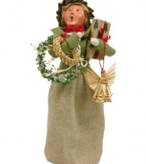 She's got her arms full, but this young woman is thrilled with the unique crafted ornaments destined to go on and under her tree. A great find from Byers' Choice.