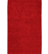 Red alert. A vivid hue makes a bold statement in any space, punctuating your decor in striking style. Hand-woven in India, this plush area rug from Surya is luxuriously rendered in indulgently soft New Zealand felted wool.