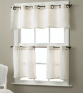 Bold grommets bring modern appeal to classic café curtains, and make setup a snap with oversized holes. Complete the look with coordinating valance.