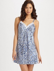 Allover whimsical shapes cover this ultra-smooth design, with exquisite venise trim at the neckline. V necklineAdjustable spaghetti strapsBack VAbout 34 from shoulder to hemPolyesterMachine washImported