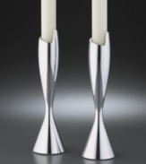 This dramatic candlestick pair adds contemporary flourish to the table. Crafted of Nambé metal alloy that has the heft and shine of solid silver but won't tarnish. Measures 7.