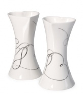 Spark some romance. A loopy platinum design and heart-shaped openings define Love Story candle holders with elegant whimsy. In lustrous white porcelain from Mikasa.