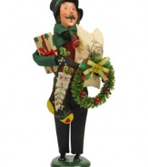 Ready to celebrate, this joyful man carries a wreath, stocking and more, all while singing beloved holiday carols. A very special figurine from the Bearing Gifts family, with the handcrafted charm of Byers' Choice.