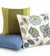 A mixture of embroidery and applique details create a modern floral design in this Martha Stewart Collection decorative pillow all in bright green and blue hues on a soft ground.