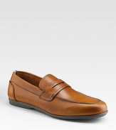 Smooth leather style crafted in Italy with penny loafer detail. Leather lining Padded insole Rubber sole Made in Italy 