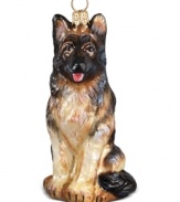 Puppy love at first sight. Just begging for a home, this German Shepherd ornament is irresistible to animal lovers in hand-painted glass by Joy to the World.
