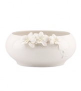 Sculpted orchids pop with a tinge of yellow against this glossy white Flora bowl A quiet beauty in graceful Lenox porcelain. Qualifies for Rebate