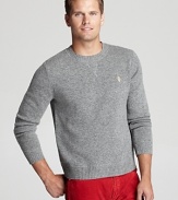 A traditional lambswool sweater is spruced up with a stitched V accent under the front collar and an owl applique logo on the chest.