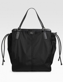 Lightweight packable nylon with adjustable leather drawstring fits beauty secrets, mags and more. Double top handles, 7½ drop Top zip closure Inside zip pocket Fully lined 14¼W X 16½H X 6½D Imported Lightweight packable nylon with adjustable leather drawstring fits beauty secrets, mags and more. Double top handles, 7½ drop Top zip closure Inside zip pocket Fully lined 14¼W X 16½H X 6½D Imported