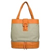 Washable coated linen tote with cowhide leather trim. Separate bottom compartment fits a pair of shoes and other travel items. Straps fit over shoulder. Interior organization pockets. Magnetic closure. Lined.