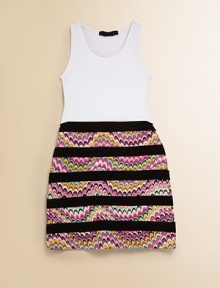 Colorful zig-zag print, contrasting stripes and a tank topper add appeal to this slim-fitting silhouette.ScoopneckSleevelessPullover stylingFitted waist85% rayon/15% spandexHand wash coldImported