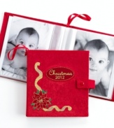 Personalize your tree and keep loved ones near with the photo album ornament from Holiday Lane. Featuring a dated cover and embroidered poinsettia motif in bold red.