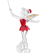 Disney's Tinker Bell takes a page from Mrs. Claus' book, dressed in a sparkling red dress and hat with platinum-white trim. Shimmering wings and a silver-tone metal wand topped with Swarovski crystal adds to the special holiday collectible.