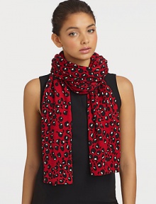 A warm knitted wool design with a bold and fun print. WoolAbout 12 X 86Dry cleanImported 
