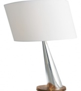 Polished but playful, the Wind table lamp mixes rich wood with polished metal in signature Nambe style. Lean it on an end table or console for a touch of whimsy.